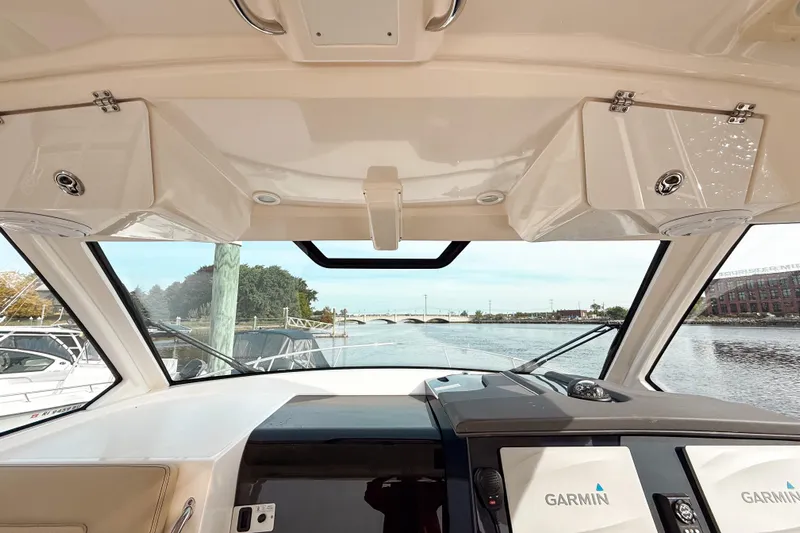  Yacht Photos Pics Interior view of 2016 Pursuit OS 355 Offshore boat with Garmin navigation system.