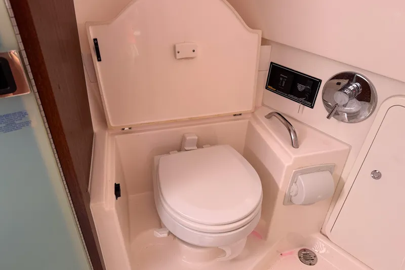  Yacht Photos Pics 2016 Pursuit OS 355 Offshore boat bathroom with toilet and sink.