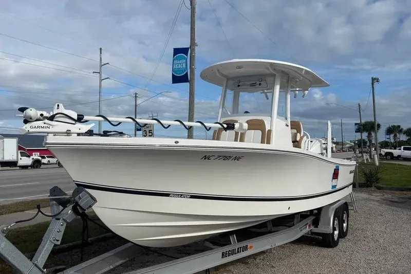  Yacht Photos Pics 2025 Regulator 26XO boat on trailer, featuring Garmin equipment, parked near Atlantic Beach.
