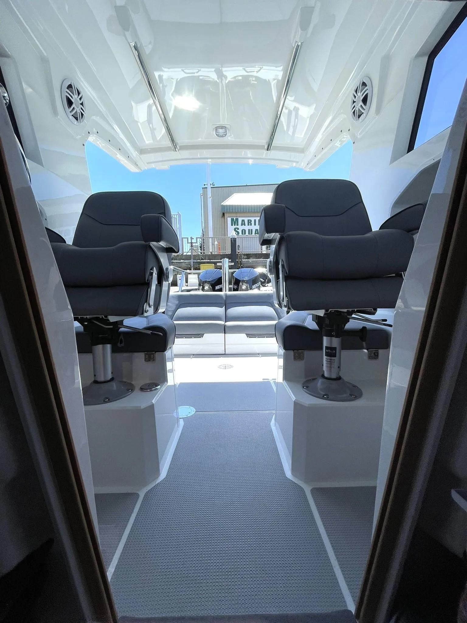 Interior view of 2024 Protector 310 Targa boat with two cushioned seats.