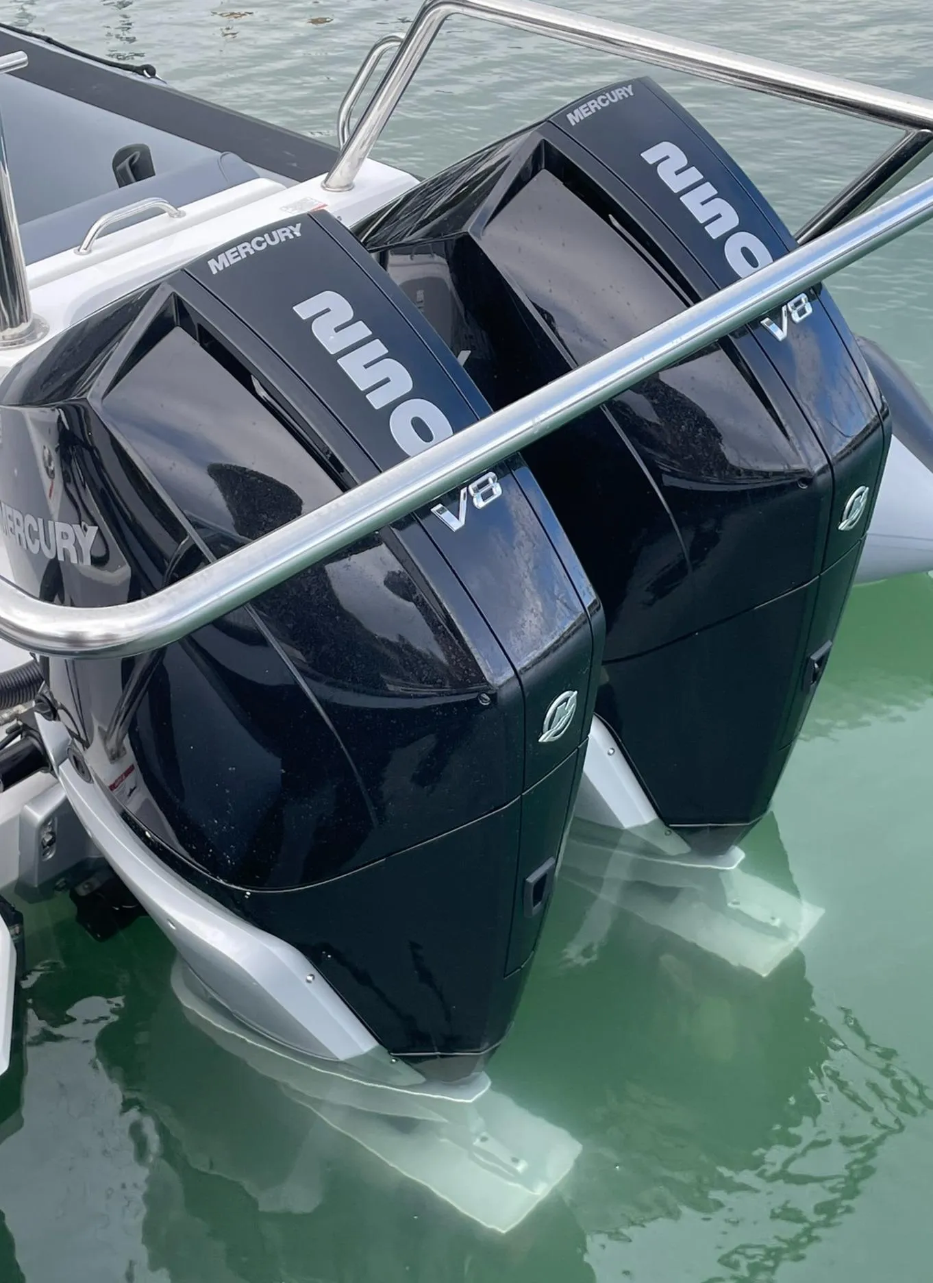 Twin Mercury V8 engines on a 2024 Protector 310 Targa boat in water.