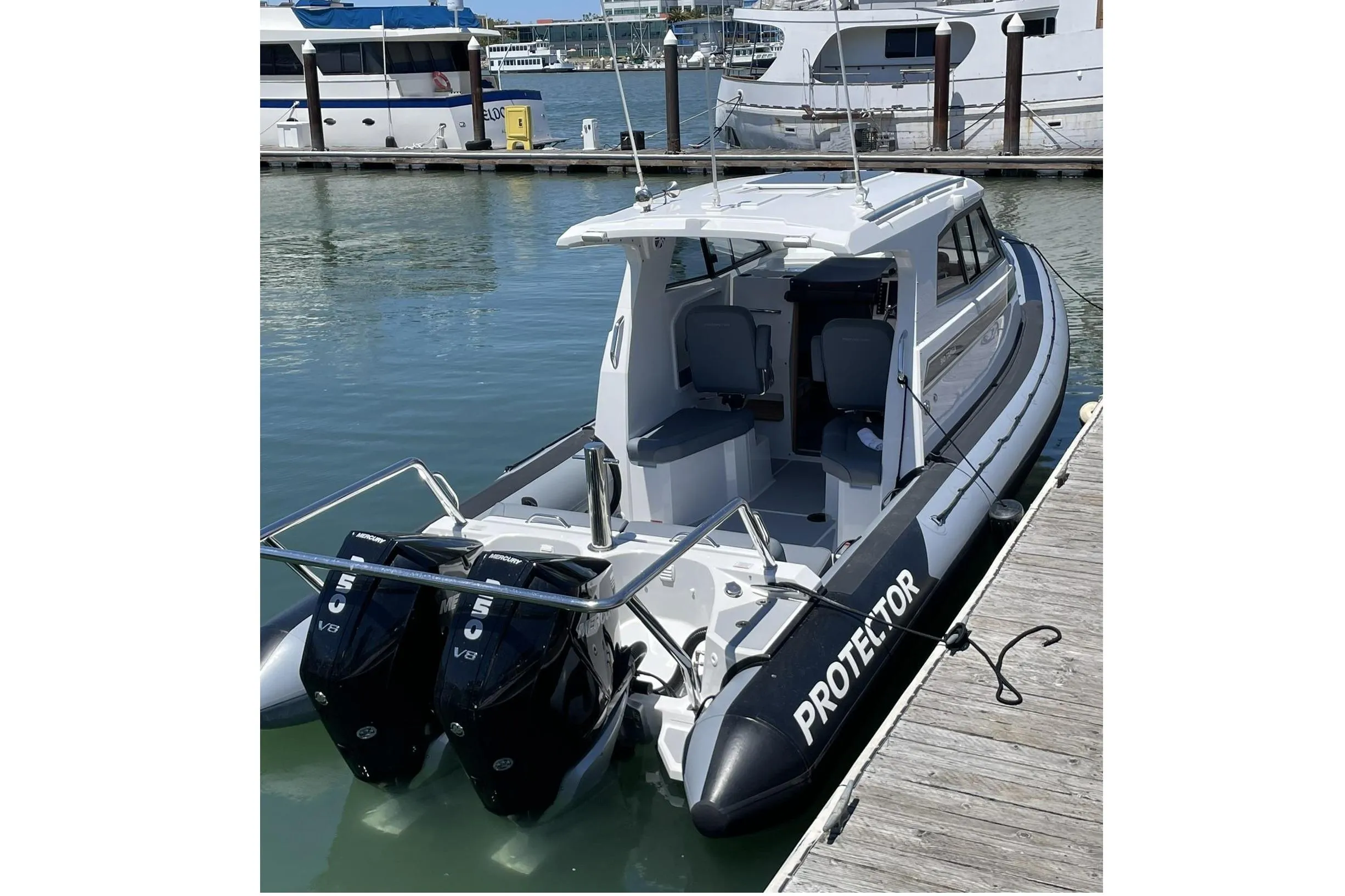 2024 Protector 310 Targa boat docked, featuring dual V8 250 HP engines.