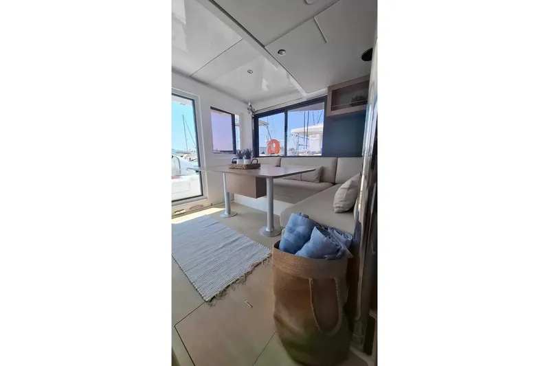 Zoie Yacht Photos Pics Modern interior of 2025 Bali CATSMART yacht with cozy seating and nautical decor.