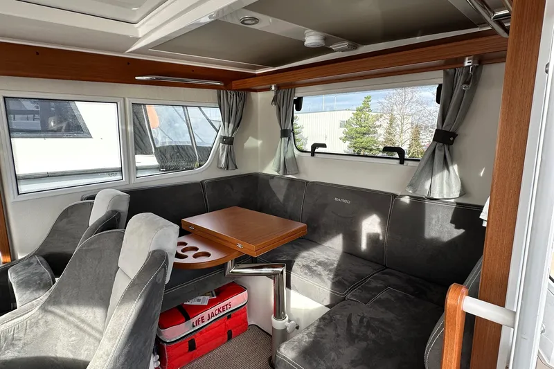  Yacht Photos Pics Interior of 2023 Sargo 28 boat with seating area and table.