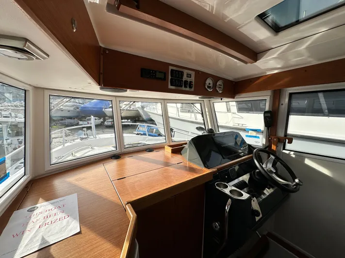  Yacht Photos Pics Interior of 2023 Sargo 28 boat with steering wheel and dashboard.