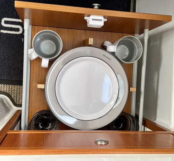  Yacht Photos Pics Sargo 28 boat interior with neatly arranged dishes and cups, 2023 model.