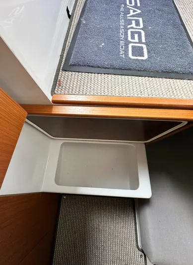  Yacht Photos Pics Interior of 2023 Sargo 28 boat with branded mat and storage compartment.