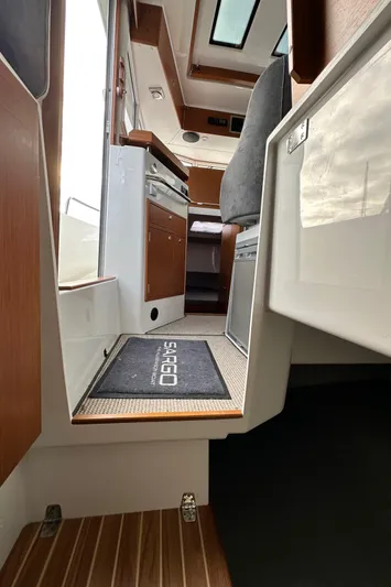  Yacht Photos Pics Interior view of 2023 Sargo 28 boat, featuring modern design and wood accents.