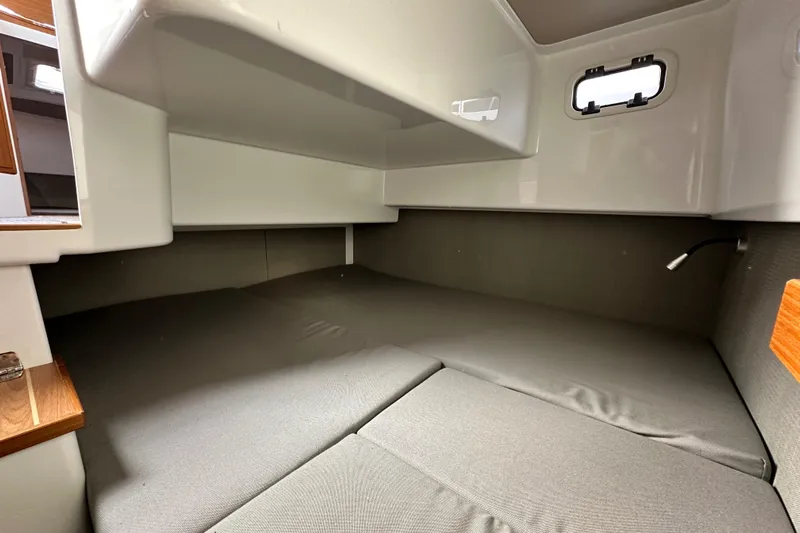  Yacht Photos Pics Interior cabin of 2023 Sargo 28 boat, featuring a cozy sleeping area.