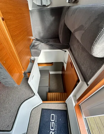  Yacht Photos Pics Interior of 2023 Sargo 28 boat, featuring wooden stairs and modern seating.