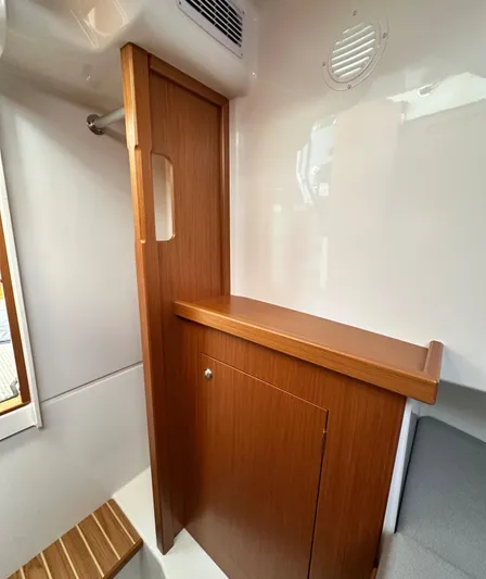  Yacht Photos Pics Interior of 2023 Sargo 28 boat with wooden cabinetry and modern design.
