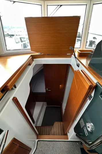  Yacht Photos Pics Interior view of 2023 Sargo 28 boat cabin with wooden finishes.
