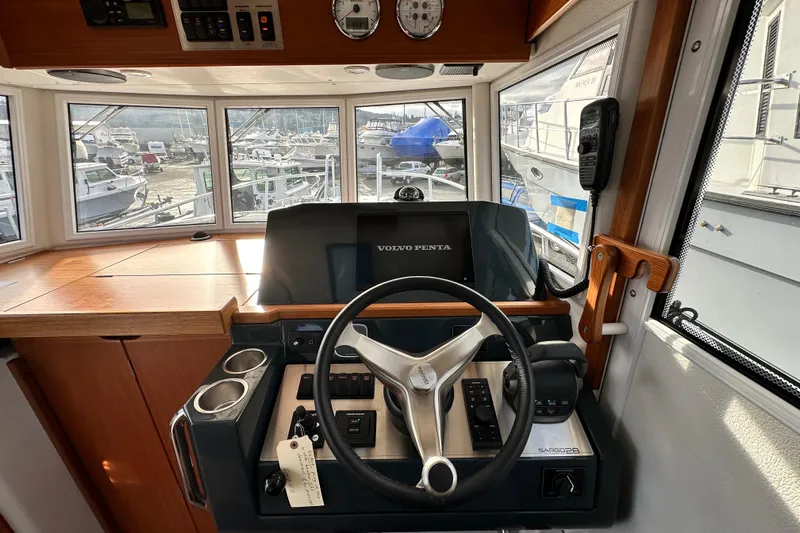  Yacht Photos Pics Interior of 2023 Sargo 28 boat with modern steering console and panoramic windows.