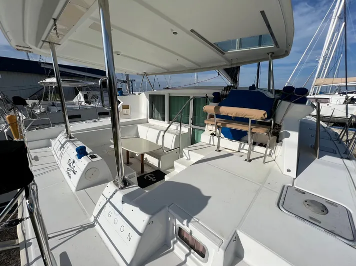 Anita Jo Yacht Photos Pics Lagoon 420 catamaran 2008 model, spacious deck with seating and table, docked at marina.
