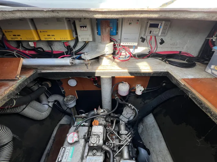 Anita Jo Yacht Photos Pics Engine compartment of a 2008 Lagoon 420 catamaran with visible wiring and components.