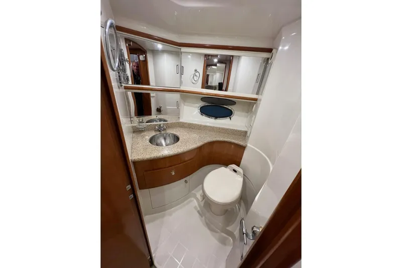  Yacht Photos Pics Luxurious bathroom in 2001 Carver 396 Motor Yacht with modern fixtures and elegant design.