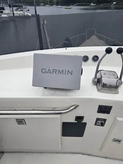 Aurora Yacht Photos Pics 1982 Tollycraft 37 Sportfish Convertible helm with Garmin navigation system.