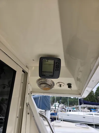 Aurora Yacht Photos Pics 1982 Tollycraft 37 Sportfish Convertible with Garmin display and cabin light.