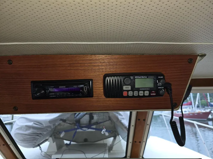 Aurora Yacht Photos Pics 1982 Tollycraft 37 Sportfish Convertible interior with Kenwood stereo and West Marine radio.