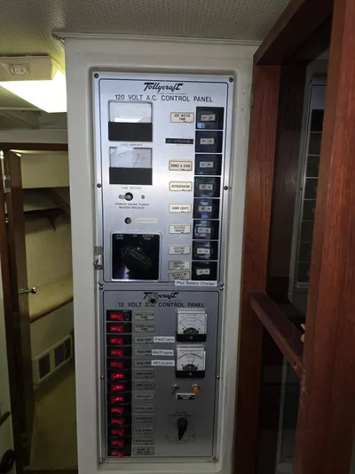 Aurora Yacht Photos Pics 1982 Tollycraft 37 Sportfish control panel with 120V AC and 12V DC systems.