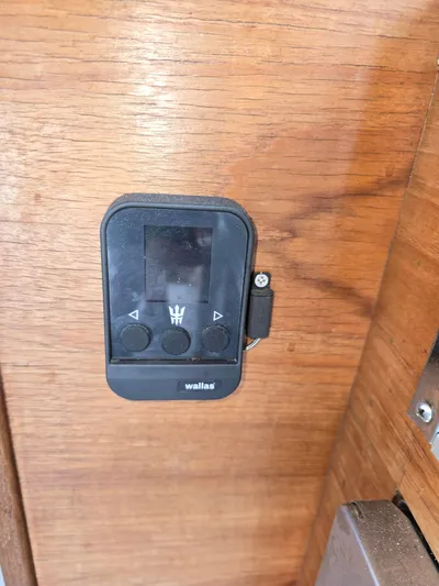 Aurora Yacht Photos Pics Control panel on 1982 Tollycraft 37 Sportfish/Convertible boat, mounted on wooden surface.