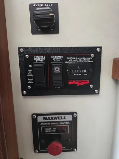 Aurora Yacht Photos Pics Control panel on 1982 Tollycraft 37 Sportfish/Convertible with audio, generator, and anchor winch controls.