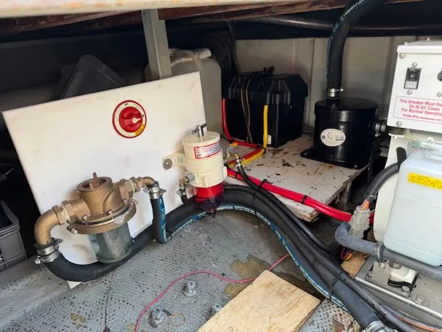 Aurora Yacht Photos Pics Engine compartment of 1982 Tollycraft 37 Sportfish/Convertible with fuel and electrical components.