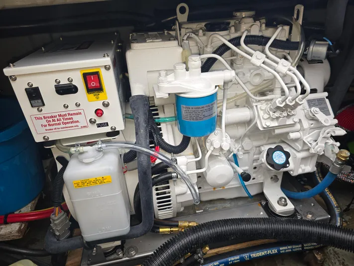 Aurora Yacht Photos Pics Engine compartment of a 1982 Tollycraft 37 Sportfish/Convertible boat, featuring mechanical components.