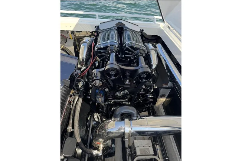 Grabbn Air Yacht Photos Pics Engine of a 1997 Fountain 42 Lightning boat, showcasing polished components and intricate design.