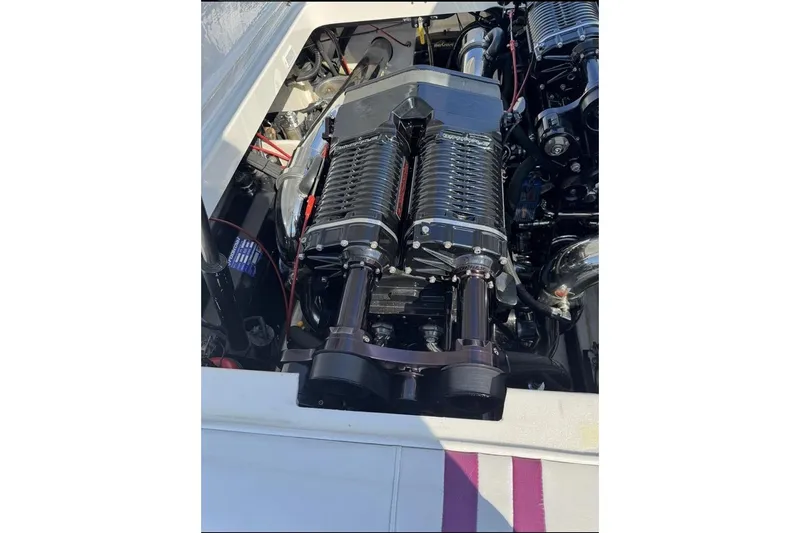 Grabbn Air Yacht Photos Pics Engine of a 1997 Fountain 42 Lightning boat, showcasing detailed mechanical components.