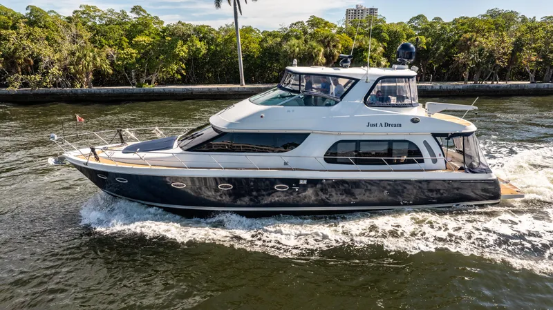 Just A Dream Yacht Photos Pics 2005 Carver 56 Voyager yacht cruising on a scenic waterway.