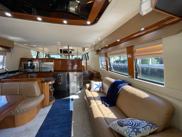 Just A Dream Yacht Photos Pics Luxurious interior of a 2005 Carver 56 Voyager yacht with elegant furnishings and modern amenities.