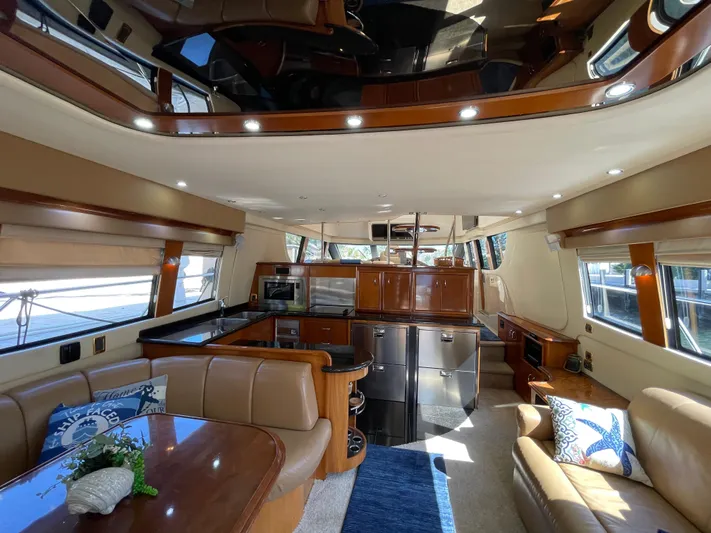 Just A Dream Yacht Photos Pics Luxurious interior of a 2005 Carver 56 Voyager yacht with modern amenities and elegant design.