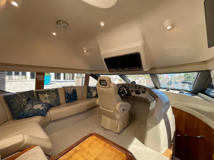 Just A Dream Yacht Photos Pics Luxurious interior of a 2005 Carver 56 Voyager yacht with plush seating and helm.