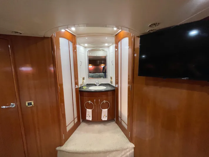 Just A Dream Yacht Photos Pics Luxurious interior of 2005 Carver 56 Voyager yacht with elegant wood finish and modern amenities.