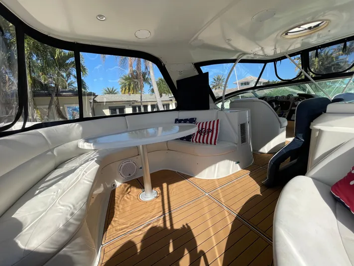 Just A Dream Yacht Photos Pics Luxurious interior of 2005 Carver 56 Voyager yacht with white seating and wooden flooring.