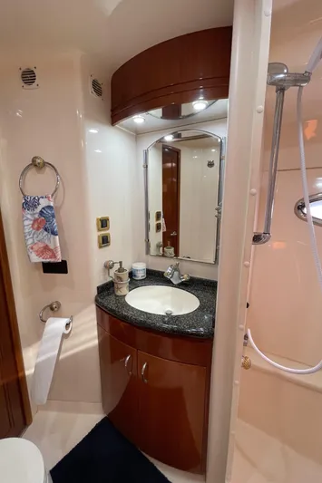 Just A Dream Yacht Photos Pics 2005 Carver 56 Voyager bathroom with sink, mirror, and shower.