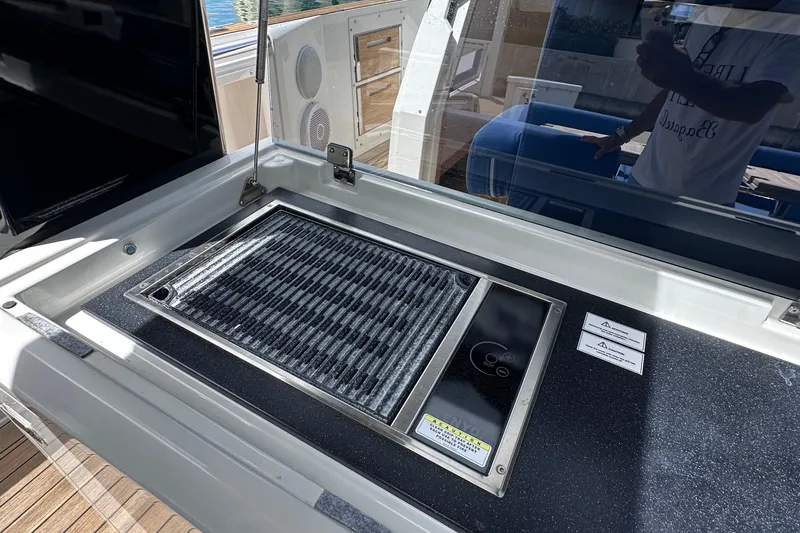 Uni Yacht Photos Pics Outdoor grill on 2020 Fjord 44 Open yacht, featuring sleek design and modern amenities.