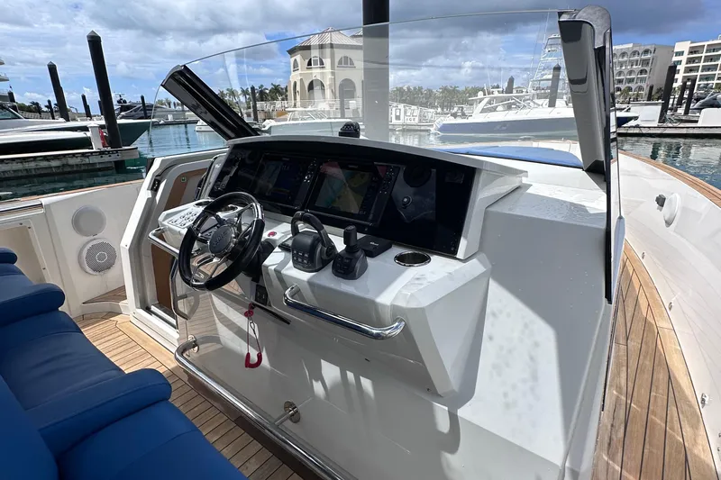 Uni Yacht Photos Pics Cockpit of 2020 Fjord 44 Open yacht with modern navigation equipment and steering wheel.