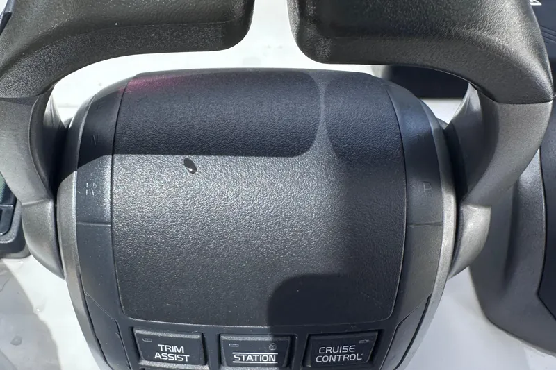 Uni Yacht Photos Pics Close-up of 2020 Fjord 44 Open boat controls with trim assist and cruise control buttons.