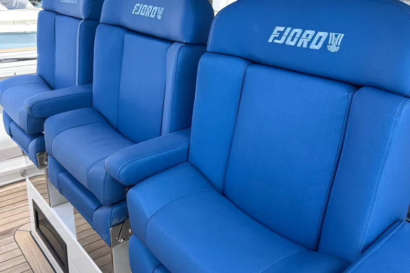 Uni Yacht Photos Pics Blue seating on 2020 Fjord 44 Open yacht, showcasing luxury and comfort.