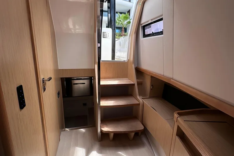 Uni Yacht Photos Pics Interior of 2020 Fjord 44 Open yacht with wooden stairs and modern design.