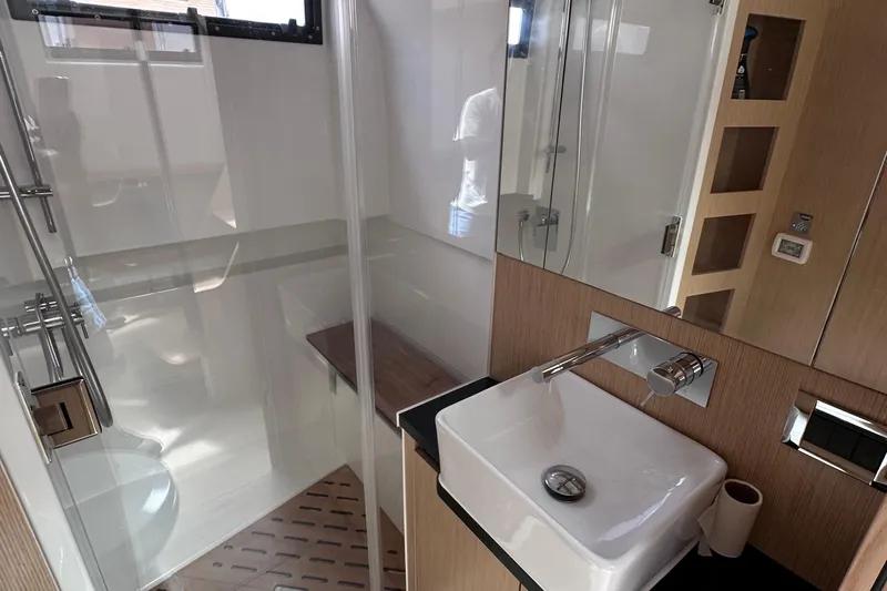 Uni Yacht Photos Pics Modern bathroom interior of 2020 Fjord 44 Open yacht with sleek fixtures and glass shower.
