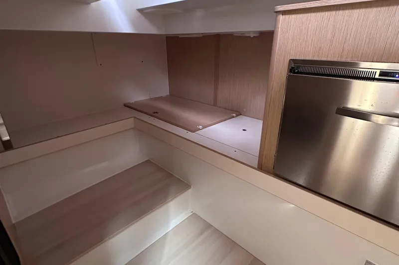 Uni Yacht Photos Pics Interior of 2020 Fjord 44 Open yacht, featuring sleek wood finishes and compact design.