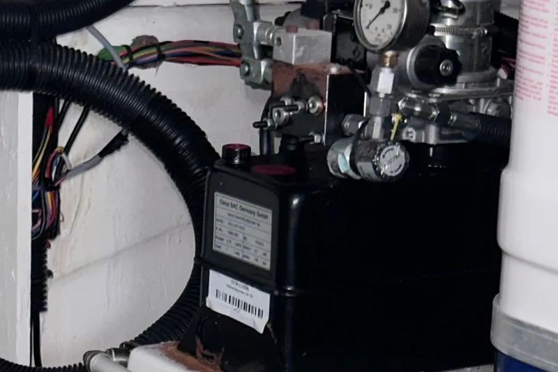 Uni Yacht Photos Pics Engine compartment of a 2020 Fjord 44 Open boat, showing mechanical components and wiring.