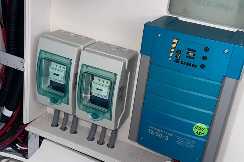 Uni Yacht Photos Pics Electrical panel with circuit breakers and a blue battery charger on a Fjord 44 Open, 2020 model.