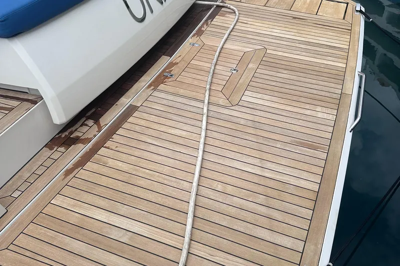 Uni Yacht Photos Pics Teak deck of 2020 Fjord 44 Open yacht with rope and water stains.