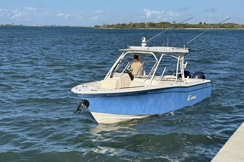 275-264 Brokerage Joe Yacht Photos Pics 2022 Grady-White Freedom 275 boat cruising on open water under clear skies.