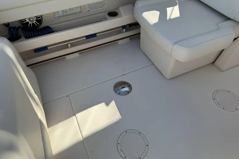 275-264 Brokerage Joe Yacht Photos Pics 2022 Grady-White Freedom 275 boat interior with seating and storage compartments.