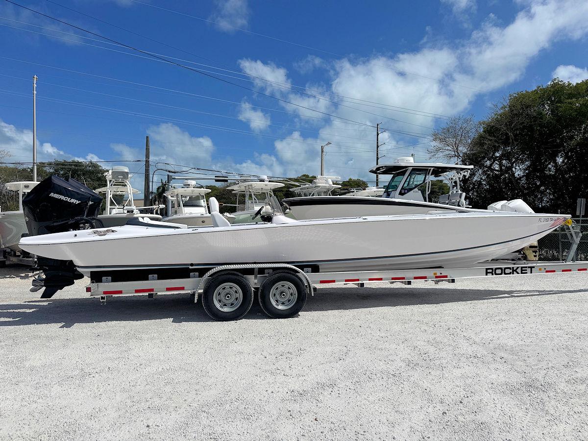 2022 Phantom 32 CC boat on trailer under blue sky.